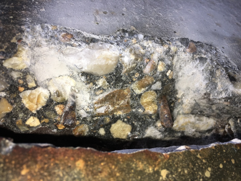 Close up Image of large cracking forming on the bridge's concrete piles